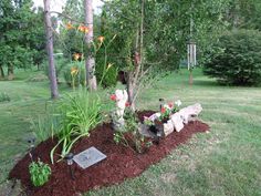 there is a garden with flowers in the middle and dirt on the ground next to it