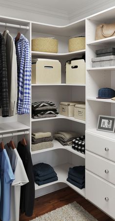 an organized closet with white shelving and drawers