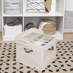 a white storage box sitting on top of a floor