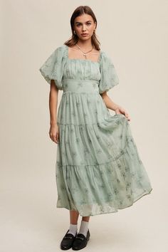 Introducing our Flower Embroidered Puff Sleeve Tiered Maxi Dress, a delightful blend of romance and elegance. Crafted from airy mesh fabric, this dress exudes ethereal charm. The square neckline with elastic detailing adds a touch of femininity, while the pleated detail on the front top enhances its visual appeal. The puff sleeves with elastic cuffs create a whimsical silhouette, complemented by the smocking on the back for a flattering fit. The tiered skirt adds movement and dimension, and hidd Pink Ballerina, Maxi Dress Green, Tiered Maxi Dress, Tier Skirt, China Fashion, Tiered Skirt, Sheer Fabrics, Flower Dresses, Embroidered Flowers