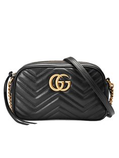 GG Marmont Zipped Colour: Black Chain shoulder strap Black matelassé chevron leather with GG on the back Antique gold-toned hardware Double G Interior open pocket Adjustable chain shoulder strap Can also be worn as a crossbody bag Zip top closure Microfiber lining with a suede-like finish Style ID: 447632 DTD1T 1000 Dust bag & Care card Made in Italy     Measurements: Width: 24cm x Height: 13cm x Depth: 7cm Chain shoulder strap with 60cm drop   * There may be a slight difference in the tone of colours depending on the resolution of your monitor.  * note that there may be a 1-2cm difference in measurements depending on how the item is measured and workmanship. Gucci Black Bag, Gucci Camera Bag, Gg Marmont Small Matelassé Shoulder Bag, Gg Marmont Small Shoulder Bag, Gucci Marmont Mini, Gucci Gg Marmont Matelasse, Trajes Kylie Jenner, Handbag Sale, Bottle Of Champagne