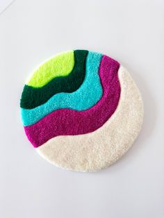 a circular rug with different colors on it