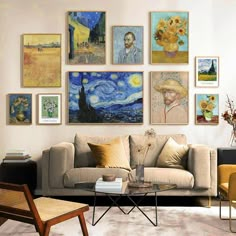 a living room filled with furniture and paintings on the wall