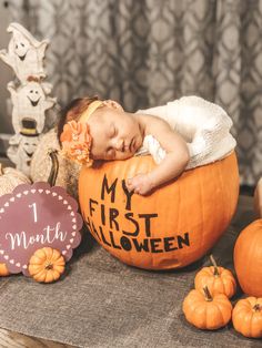 a baby is sleeping in a pumpkin