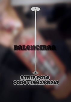 a blurry photo of a pole with the words balenona on it and a woman's face in the background