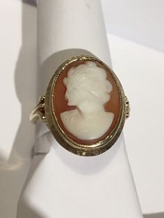 "This is a beautiful condition vintage 14kt yellow gold genuine hand carved shell cameo. Slightly worn but profile and features are very well defined in this classic face. Beautiful beaded bezel holds this cameo in place and the setting and fine detail on shank of ring are stunning. Cameo measures approximately 1/2\" wide and 5/8th \" long. Size 6. Shank is sturdy and this ring will last for generations to come. A true timeless classic. Inside is hallmarked(unreadable) and 14kt is stamped in it. Gold Cameo Signet Ring Collectible, Gold Signet Ring With Cameo Collectible, Vintage Cameo Signet Ring For Anniversary, Cameo 14k Gold Rings For Collectors, Collectible 14k Gold Cameo Rings, Vintage 14k Gold Cameo Rings, 14k Gold Cameo Rings For Collectors, Vintage Cameo Signet Ring, Classic Gold Cameo Signet Ring