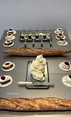 a table topped with lots of different types of desserts on top of each other