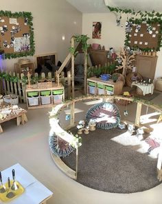 a room filled with lots of toys and plants on the walls, including fake trees