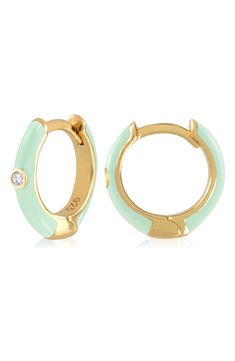 Easy-to-wear hoop earrings will add significant polish to even your most casual ensembles. 1/2" drop; 1/8" width Hinge with snap-post closure Sterling silver with goldtone plate/cubic zirconia Imported Enamel Huggie Hoop Earrings For Pierced Ears, Trendy Round Enamel Hoop Earrings, Trendy Enamel Hoop Jewelry, Everyday Enamel Hoop Earrings, Hoop Huggie Earrings In Enamel, Enamel Huggie Hoop Earrings, Small Hoop Enamel Earrings, Green Enamel Hoop Earrings, Green Enamel Hoop Jewelry