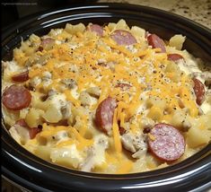 a crock pot filled with cheese and pepperoni