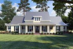 a large white house sitting on top of a lush green field