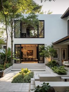 an outdoor living area with stairs and plants