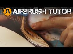 an image of a person's hand on top of a book with the title, airbrush tutor