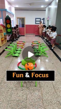 the children are playing with their toys in the school hall, and it is fun