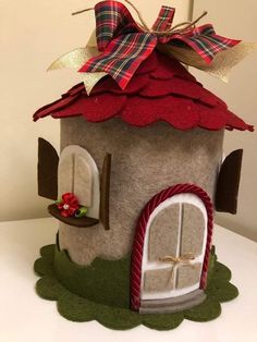 a house made out of felt with a bow on top