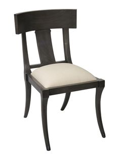 a wooden chair with a white cushion on it