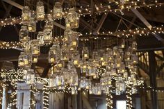 a large chandelier filled with lots of lights hanging from it's ceiling