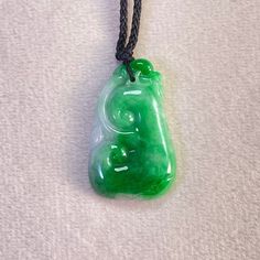 Green Natural Ruyi Jade, Genuine Jadeite Pendant, Hancrafted Ruyi Jadeite, Handmade Jade Jewelry Materials: Genuine Type A jadeite with adjustable string Dimension:  Height: 29.6 mm Width: 18.8 mm Thickness: 4.7 mm The jadeite pendant are made from natural real Burmese jadeite stone. They are handmade items. This is the perfect gift for mom, wife, fiancée, girlfriend, valentine, daughter, family or friend. It is a special gift for mother's day, valentine's day, wedding, anniversary, birthday, Ch Green Jade Amulet Necklace, Traditional Green Jade Necklaces, Green Carved Amulet Necklace, Jewelry Materials, Jade Jewelry, Jade Pendant, Perfect Gift For Mom, Type A, Product Images