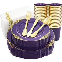 purple and gold dinnerware set with matching napkins, forks and spoons on white background