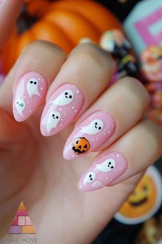 Embrace the spooky spirit with these cute ghost and pumpkin nails. The soft pink background makes the designs pop, creating a fun and festive look. Perfect for Halloween parties and gatherings. Check out nailhow.com for more spooky inspiration. 🎃👻 Save this pin for later! Pink Halloween Nails Coffin Shape, Short Cute Nails Halloween, Positive Nails, Halloween Nail Designs With Ghosts, Pink Halloween Gel Nails, Cute Girly Halloween Nails, Cute Ghost Nails Pink, Girly Nail Designs Pink, Halloween Nail Designs Ghost