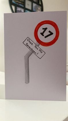 a greeting card with a street sign and the number 17 on it's side