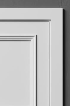 an image of a white cabinet door on the wall