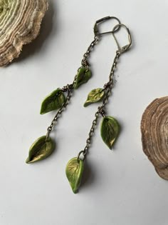 May the leaves whisper wisdom to you straight from the source.  As one leaf sheds, a new one is given space to grow 🍃  Each leaf is hand-formed with clay then attached to the antiqued bronze chain. Leaf Earrings Clay, Goblin Core Earrings, Handmade Bronze Leaf Jewelry, Jewellery With Clay, Nature Inspired Earrings, Earthy Clay Earrings, Goblincore Accessories, Leaf Clothes, Clay Leaf Earrings