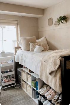 a bedroom with a bed and shelves filled with shoes