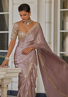 Buy Pink Satin Saree With Embroidered Mirror Blouse by Vvani by Vani Vats at Fabilicious Fashion! Shop made-to-measure Indian wedding wear and jewellery with fast shipping to USA, UK, and Canada. Blouse Designs For Satin Silk Saree, Saree For Cocktail Party Indian Weddings, Girly Saree Indian Weddings, Satin Sarees With Designer Blouses, Party Wear Sarees For Women, Sangeet Saree Outfit, Rose Gold Colour Saree, Partywear Saree Blouse Designs, Janhvi Kapoor Indian Outfits