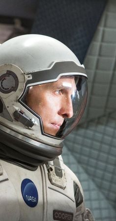 a close up of a person wearing a space suit