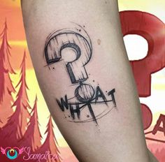 a person with a tattoo on their leg and the word what? written in black ink