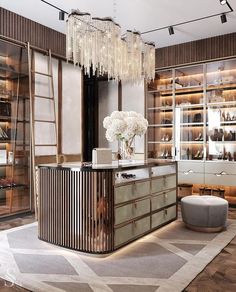 a room filled with lots of glass shelves and chandelier hanging from the ceiling