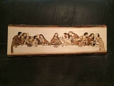 the last supper is painted on a piece of wood