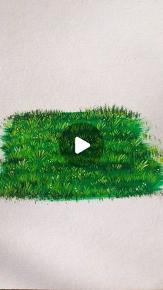 the grass is being drawn with colored pencils