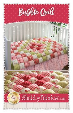 a crib bed with a red and green quilt