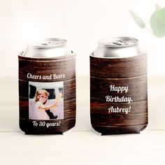 two beer cans with the words cheers and beers on them, one has a picture of a woman