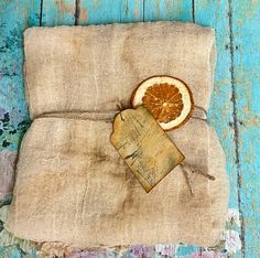 an old piece of cloth with a slice of orange on it