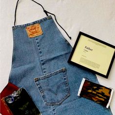 * (1) Levi’s Denim Apron, This Apron Is Upcycled And Are Perfect For Dads Who Are Grill Masters, Barbers And/Or Construction Junkies, * (1) Shaving Catcher Bib In White Color Way. This Is Handy For Beard Shaving And Helps Reduce Messes. Brand New, Never Used, And Will Come In Its Own Pouch * (1) Framed Father Print, This Print Display The Meaning Of A “Father” And Will Come With Its Own Wooden Frame. Grilling Gifts For Men, Jean Aprons, Levis Overalls, Jean Apron, Levis Black Jeans, Beard Shaving, Men 90s, Black Jean Jacket, Denim Apron