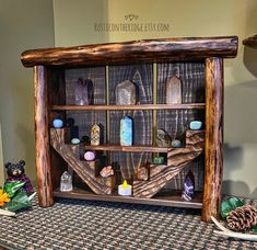 a wooden shelf filled with rocks and other items