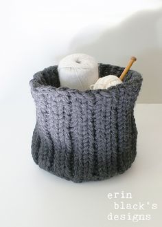 there is a knitted basket with yarn in it