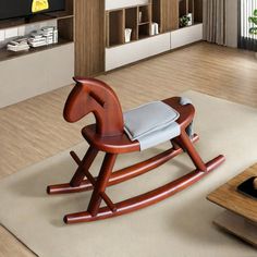 a rocking horse chair in the middle of a living room