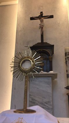 an altar with a crucifix in the background