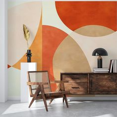 a living room with an abstract wallpaper and wooden furniture