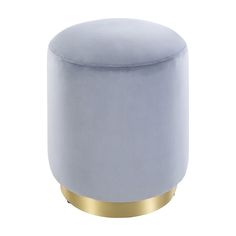 a blue velvet stool with gold trim around the legs and foot rests on a white background