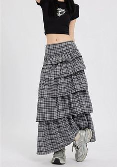 Channel understated chic with this Layered Plaid Maxi Skirt featuring delicate ruffle details.
Crafted from a comfortable blend of mainly cotton, this skirt showcases a multi-layered design that adds a playful twist to the classic plaid pattern. The high-waist cut ensures a flattering silhouette, while the versatile style makes it easy to dress up or down. It's a piece that carries a perfect balance of edgy and professional aesthetics.
Pair this skirt with a tucked-in graphic tee and sneakers fo Chic Tiered Maxi Skirt With Layered Hem, Casual Tiered Pleated Maxi Skirt, Relaxed Tiered Skirt For Spring, Spring Tiered Voluminous Skirt, Chic Relaxed Tiered Skirt, Casual Tiered Flowy Skirt, Spring Layered Hem Midi Skirt, Layered Hem Midi Skirt For Spring, Spring Skirt With Layered Long Hem