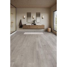 a bathroom with wood flooring and two sinks