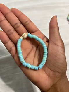 A light blue and teal clay bead bracelet, topped off with a turtle charm in the middle. Homemade Bracelets, Clay Bead Bracelet, Clay Bracelet, Turtle Charm, Clay Bead, A Turtle, Clay Beads, Bead Bracelet, Favorite Jewelry