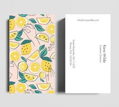 a business card with lemons and leaves on it, sitting next to an envelope