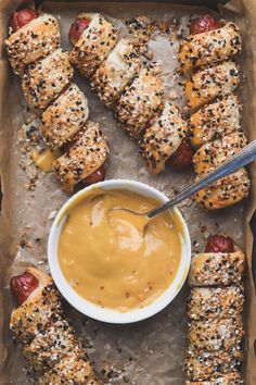 hotdogs wrapped in bread with mustard and ketchup