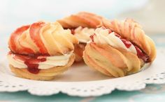 three small pastries on a white plate